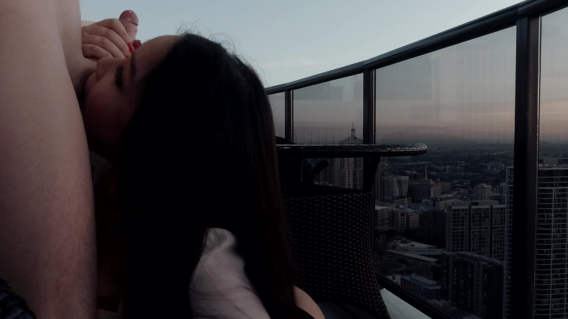 Giving head on a sky high balcony