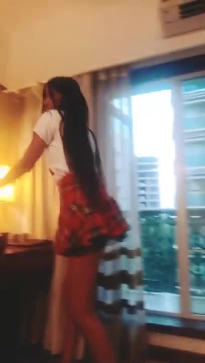 sexy in a mini skirt. damn!