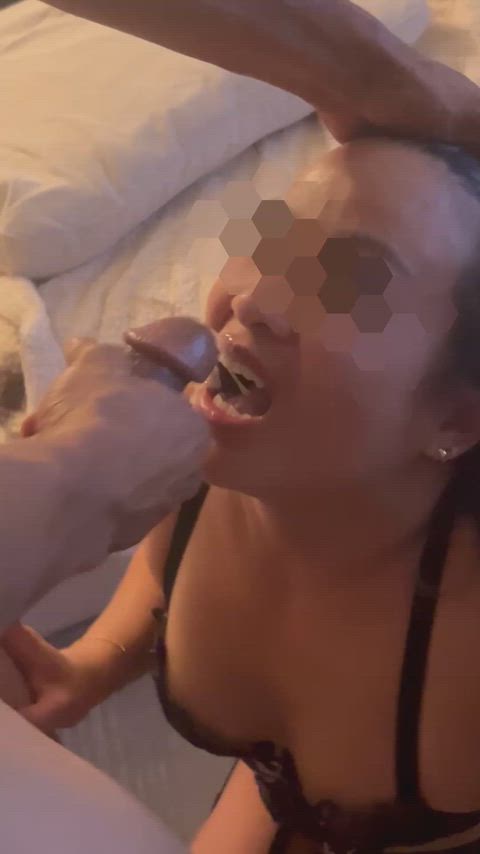 Licks her lips clean once her bull finishes on her face