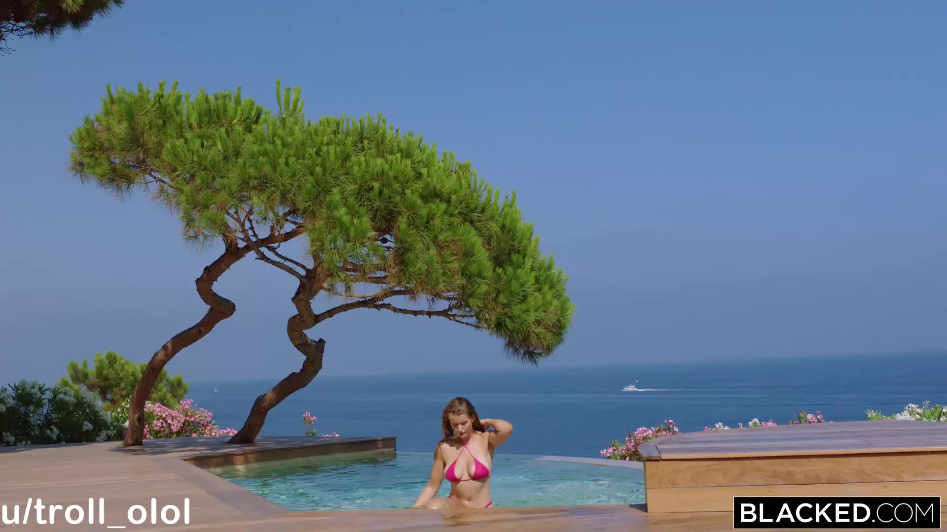Mia in a pink bikini