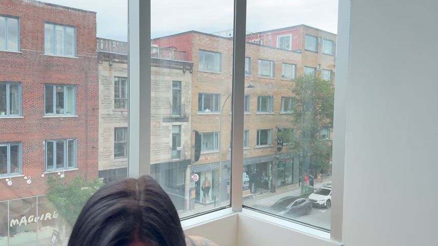 Taking it in the mouth in front of the window, so everyone can see