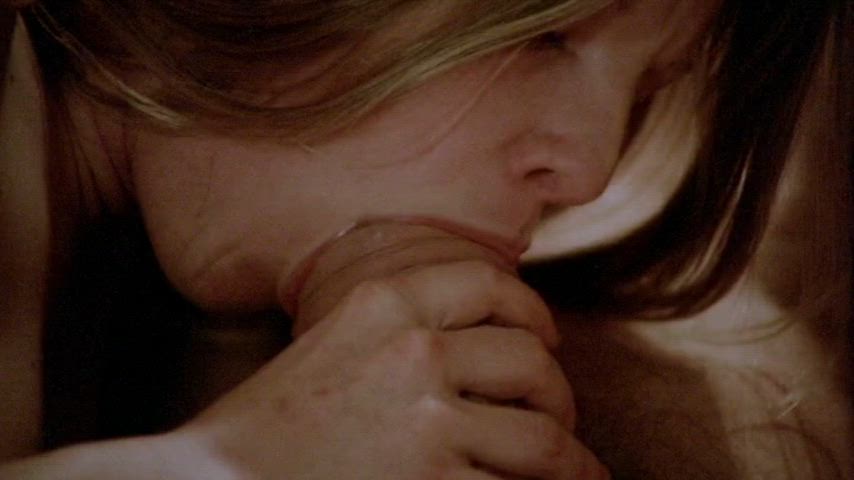 John Holmes having his swollen cock pampered...